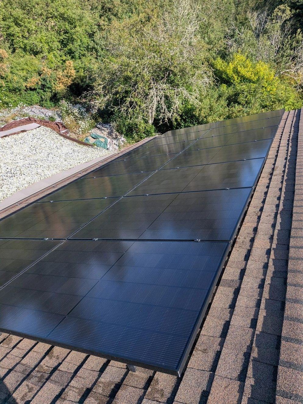 Clean solar panels reflecting the sky after cleaning